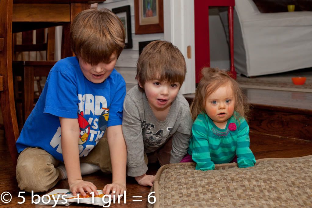 Family Time: Patrick reading to his brother and sister