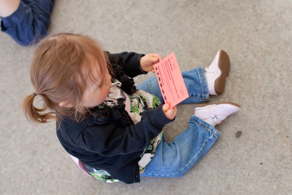 Grace holding her ticket to the zoo