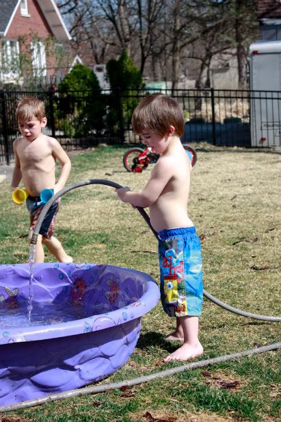 Boys playing in the water on a Saturday afternoon