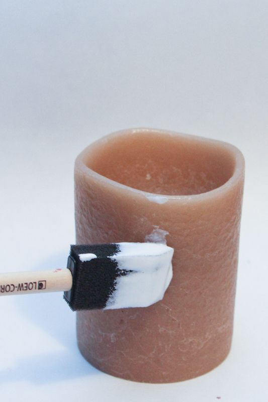 Using a foam paintbrush, paint mod podge onto the candle. Use the foam brush to paint Mod Podge on Your Deco Candle base