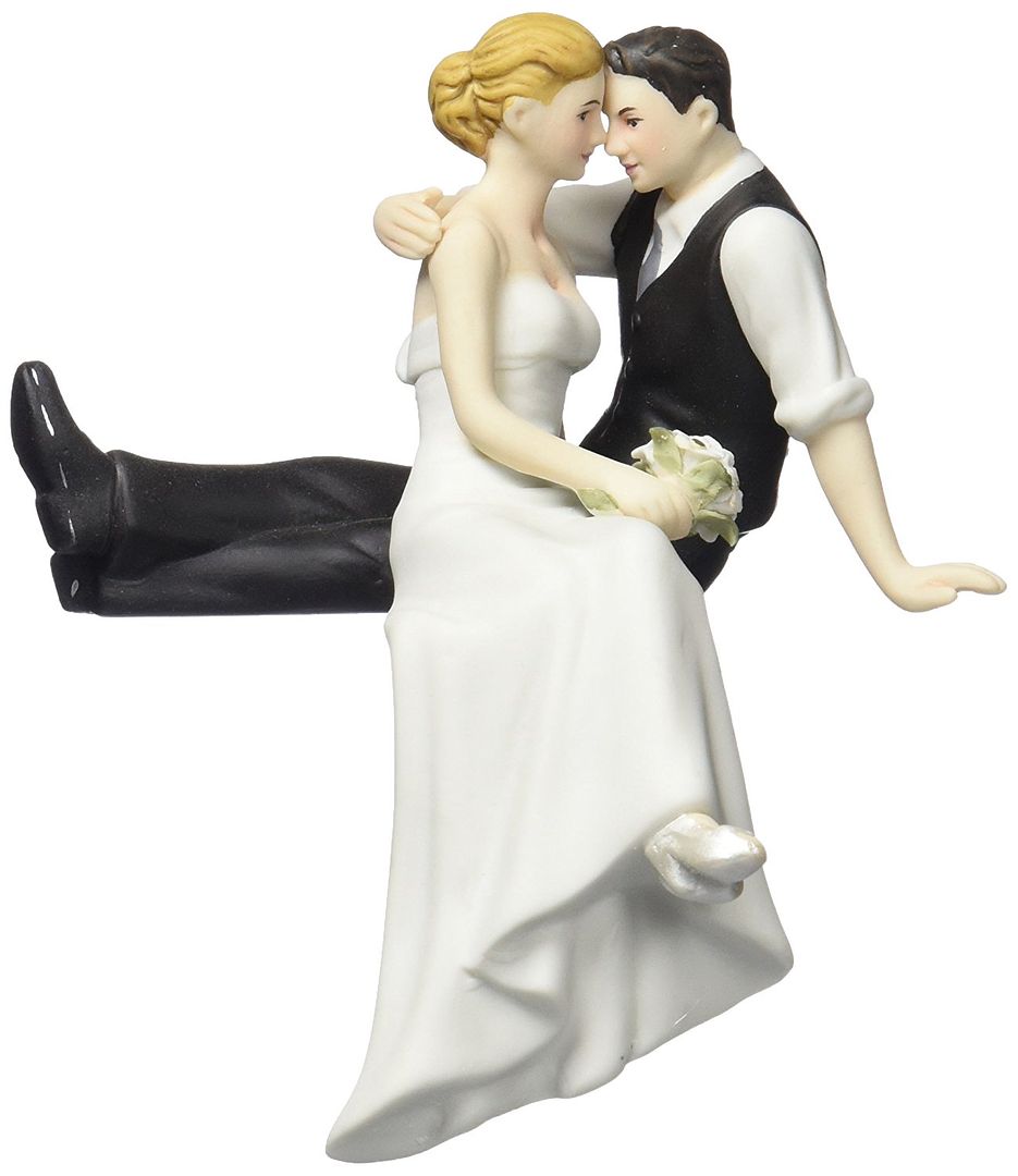 bride and groom intimately staring each other cake topper